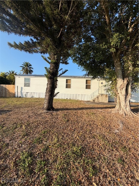 1660 Davidson Road Clewiston, FL 33440 - Photo 6 of 23 a house with trees in front of it