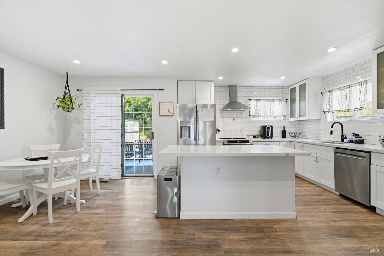 Welcome to 5193 Firestone Place, a beautifully updated 3-bedroom, 2.5-bath townhouse offering 1,467 square feet of comfortable living in one of Santa Rosa's most sought-after locations, Rincon Valley, known for its highly regarded schools and exceptional convenience. Thoughtfully remodeled with timeless finishes, this move-in-ready home features luxury vinyl plank flooring throughout the main living areas, creating a seamless flow and modern appeal. The bright and inviting kitchen is enhanced with quartz countertops, updated appliances, and a sliding glass door that opens to a private, shaded backyard—an ideal setting for morning coffee, outdoor dining, or simply unwinding at the end of the day.