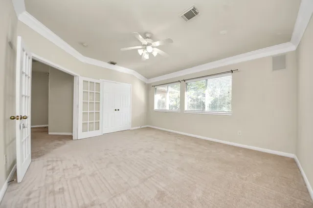 a view of an empty room with a window