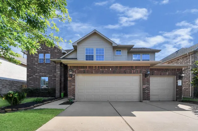 a front view of a house with a garage