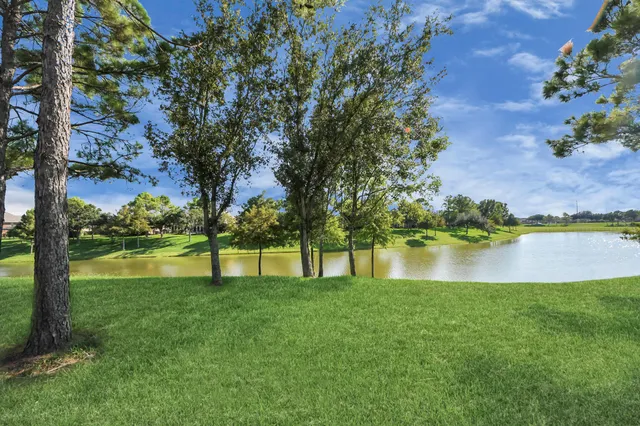 a view of lake with green space