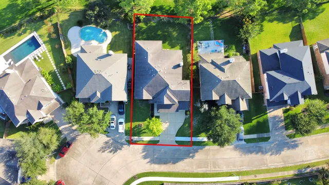 a view of a house with a yard and garden