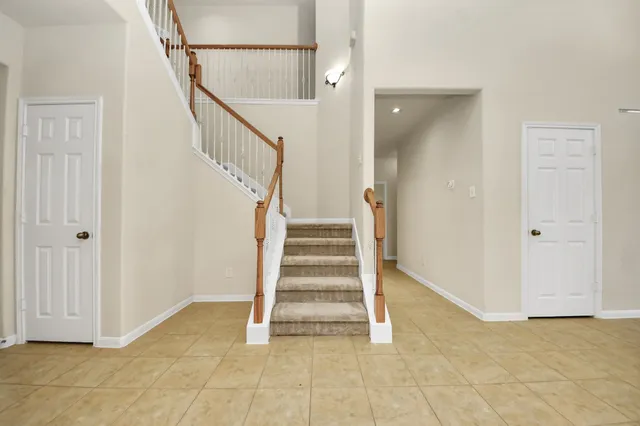 a view of entryway with stairs and a window