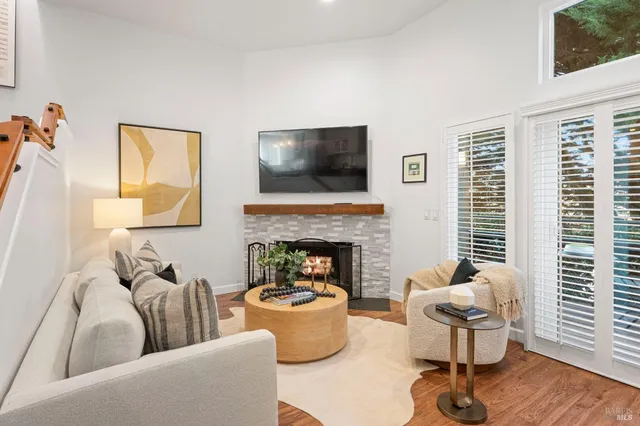 a living room with furniture and a fireplace