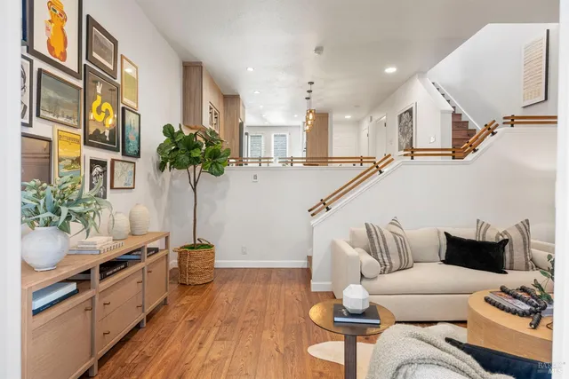 a living room with furniture and a potted plant