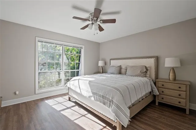 a bedroom with a large bed and a window