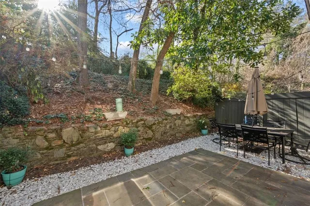 a view of a backyard with sitting area