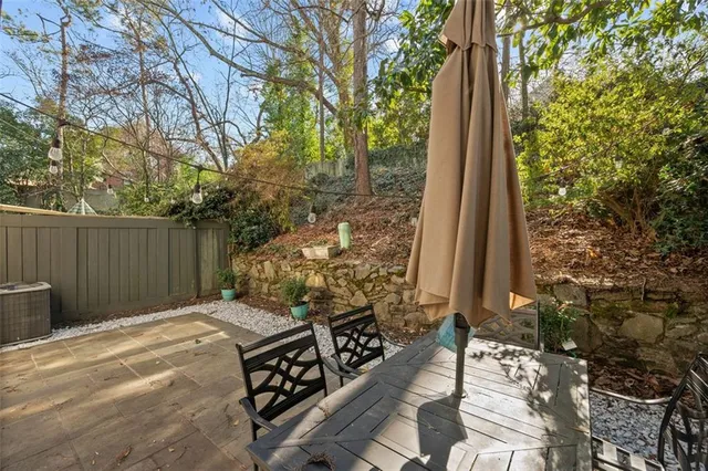 a view of a backyard with chairs