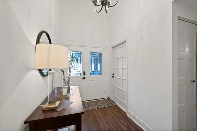a view of a workspace with furniture and wooden floor