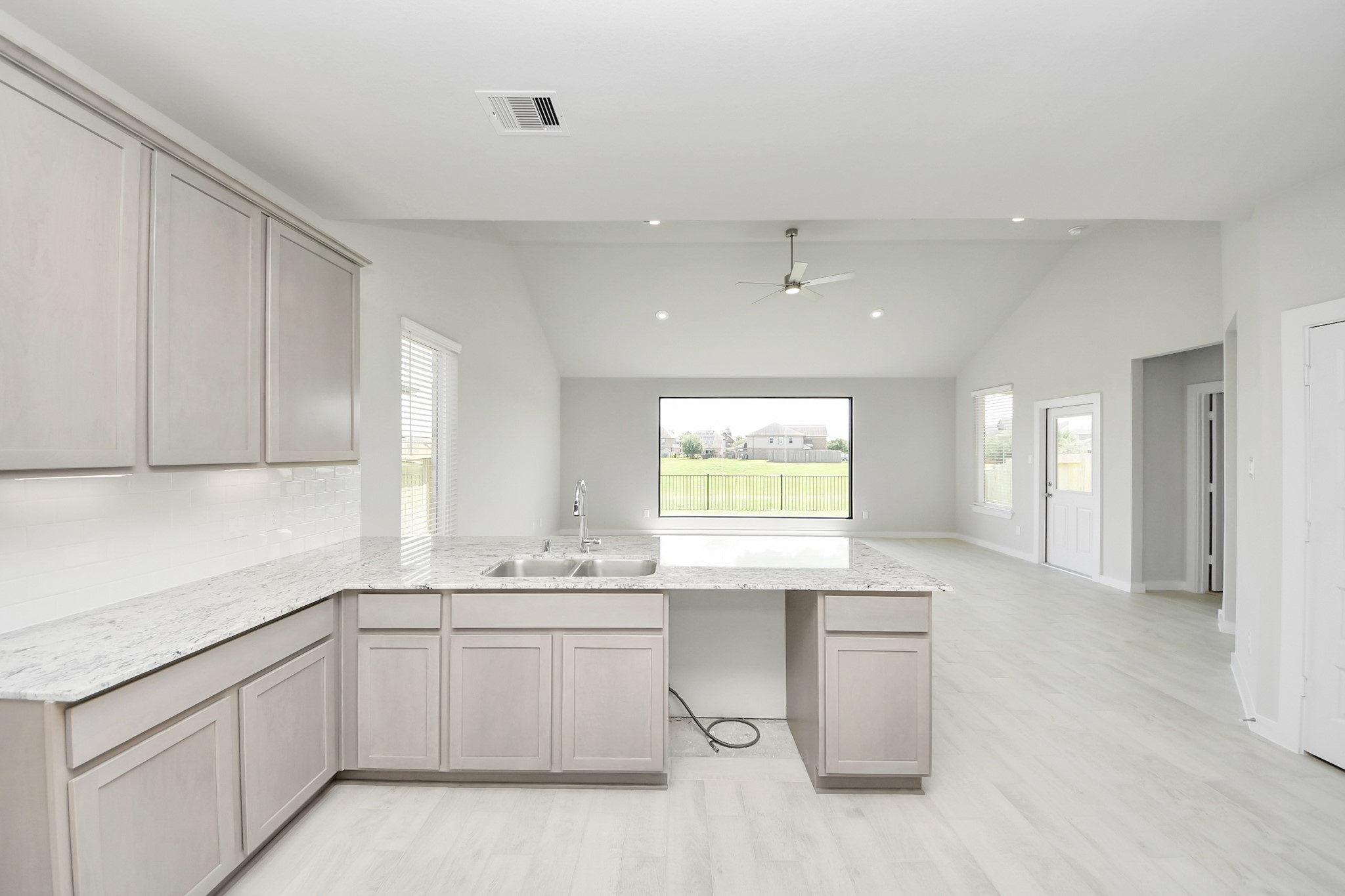 14906 Rural Rdg Road Cypress, TX 77429 - Photo 12 of 46 a kitchen with a sink cabinets and window