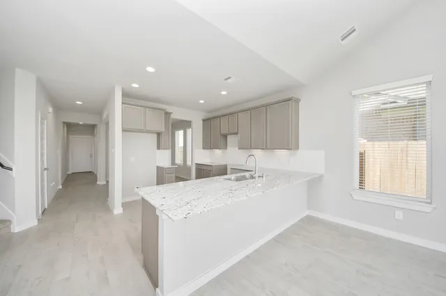 a view of a kitchen with a sink