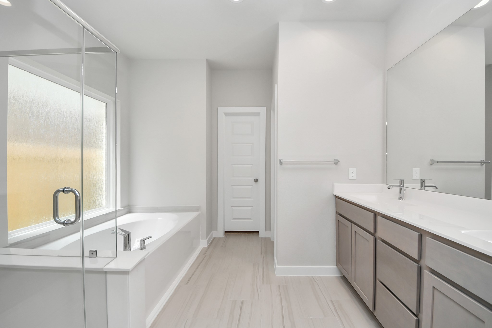 14906 Rural Rdg Road Cypress, TX 77429 - Photo 21 of 46 a bathroom with a tub sink and mirror