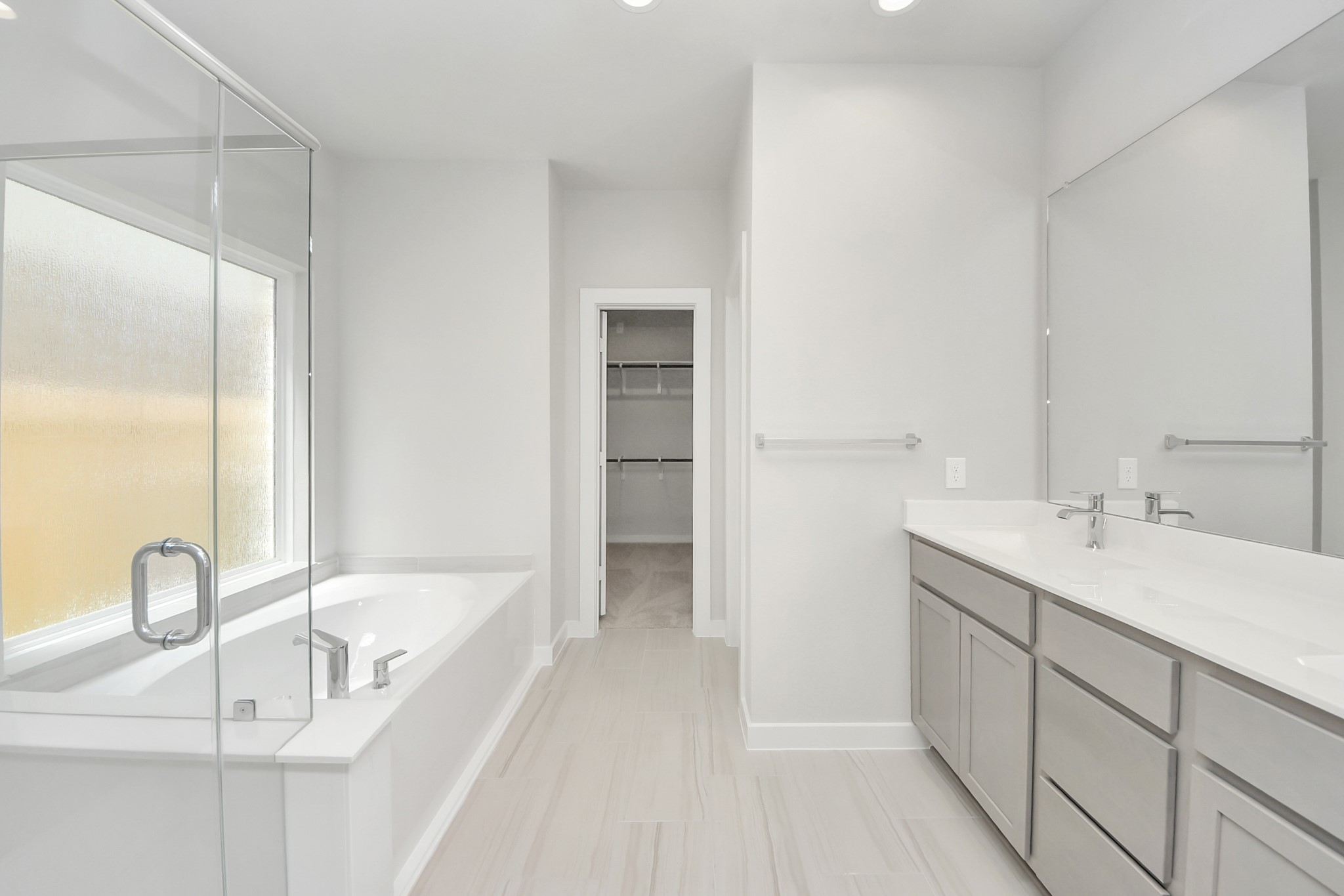 14906 Rural Rdg Road Cypress, TX 77429 - Photo 23 of 46 a bathroom with a bathtub and a sink