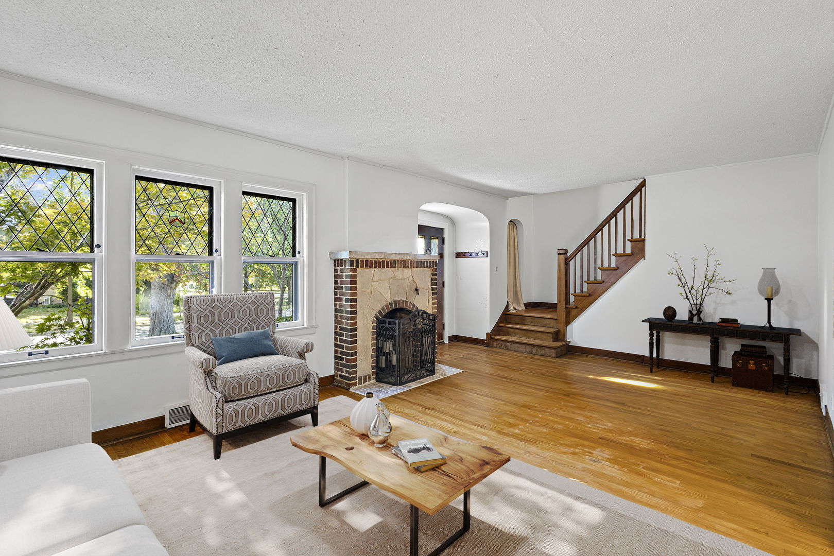 450 Kent Road Riverside, IL 60546 - Photo 2 of 29 a living room with furniture large window and a fireplace