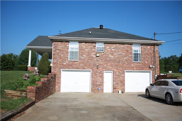 3982 Trough Springs Road Adams, TN 37010 - Photo 3 of 20 Side of home showing garage areas. Lots of storage and space enough to park extra car or truck