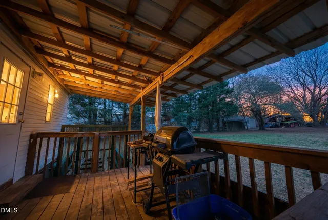 a view of a chairs and table in the balcony