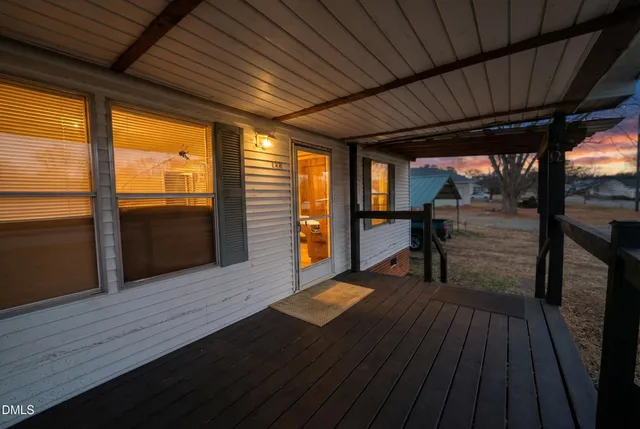 a view of outdoor space with wooden floor