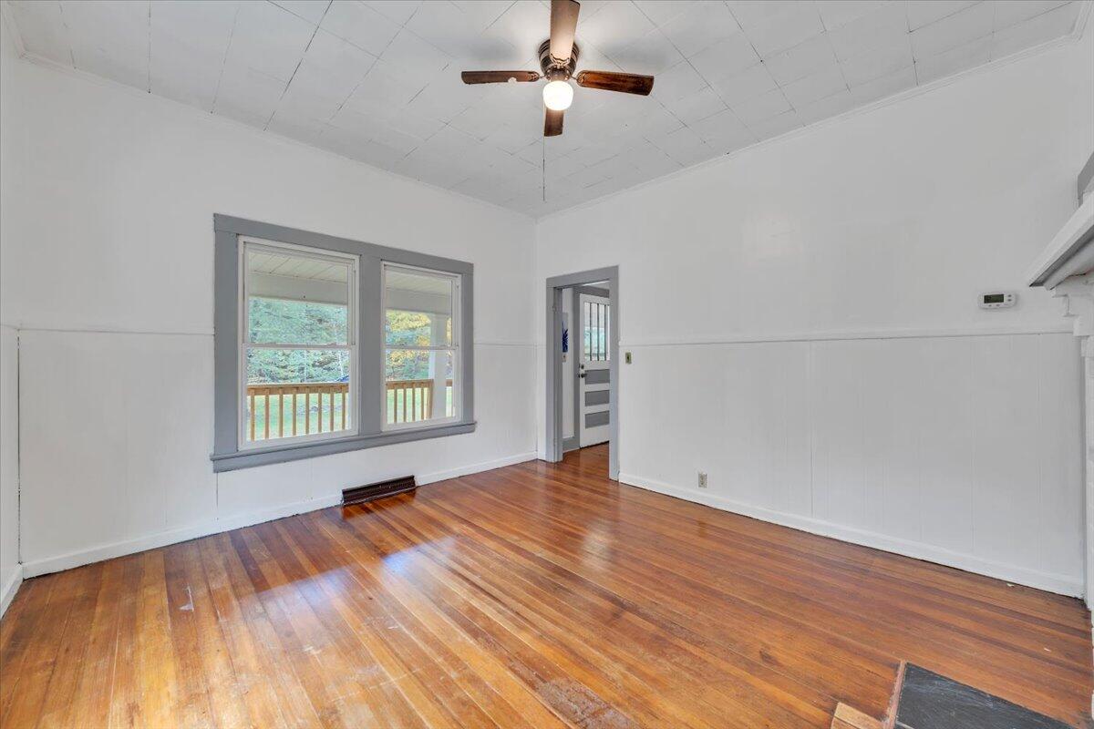 6973 Henry Road Henry, VA 24102 - Photo 11 of 110 a view of empty room with wooden floor and fan