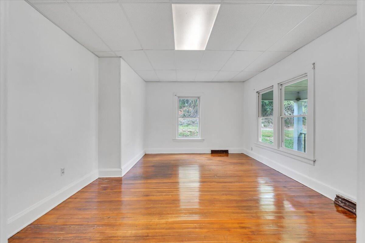 6973 Henry Road Henry, VA 24102 - Photo 14 of 110 a view of an empty room with wooden floor and a window