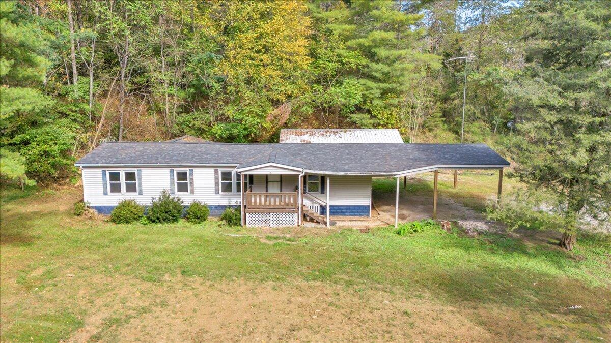 6973 Henry Road Henry, VA 24102 - Photo 2 of 110 a front view of a house with garden