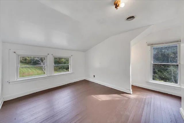 an empty room with windows