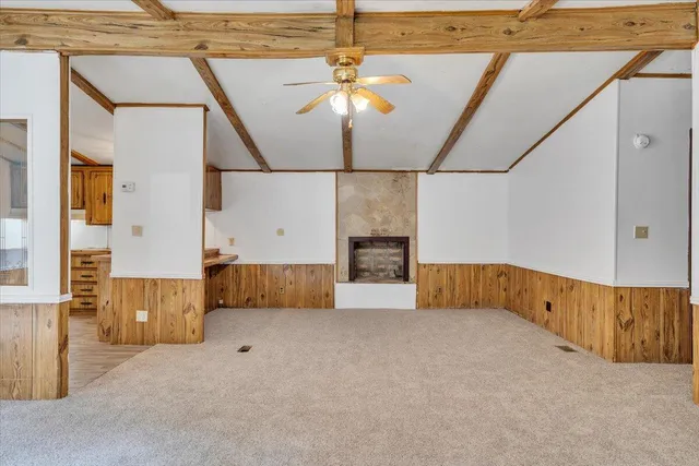 a view of a house with yard and sitting area