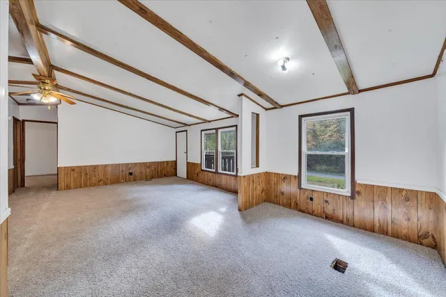 a view of a house with a backyard