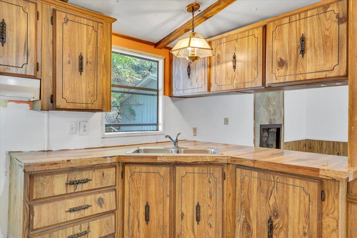 6973 Henry Road Henry, VA 24102 - Photo 42 of 110 a kitchen with stainless steel appliances granite countertop a sink and cabinets