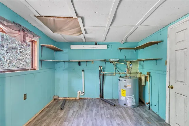 a side view of a house with a yard