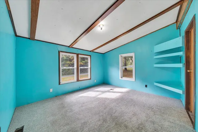 a view of an empty room with garage