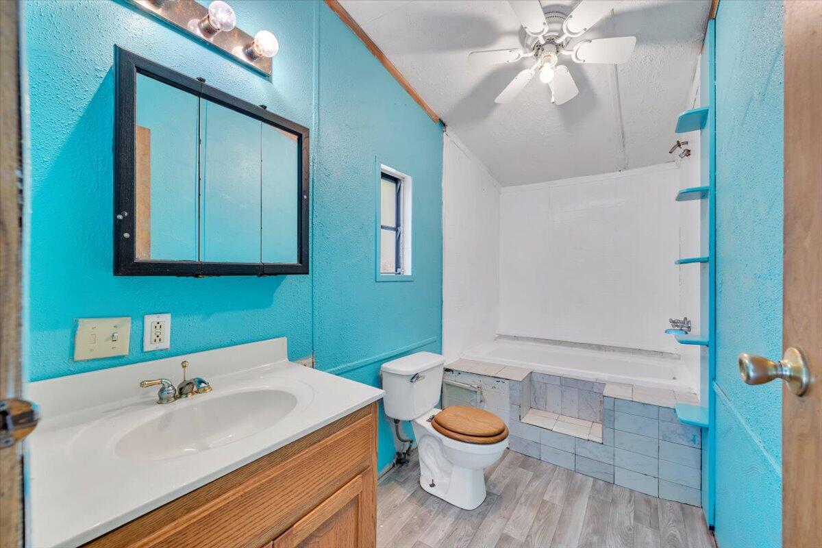 6973 Henry Road Henry, VA 24102 - Photo 50 of 110 a bathroom with a sink a toilet and mirror