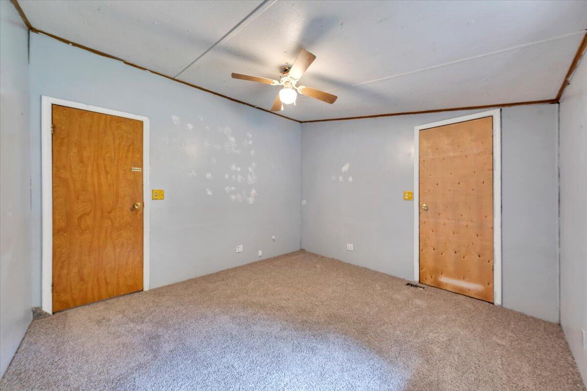 6973 Henry Road Henry, VA 24102 - Photo 53 of 110 an empty room with closet and a chandelier fan