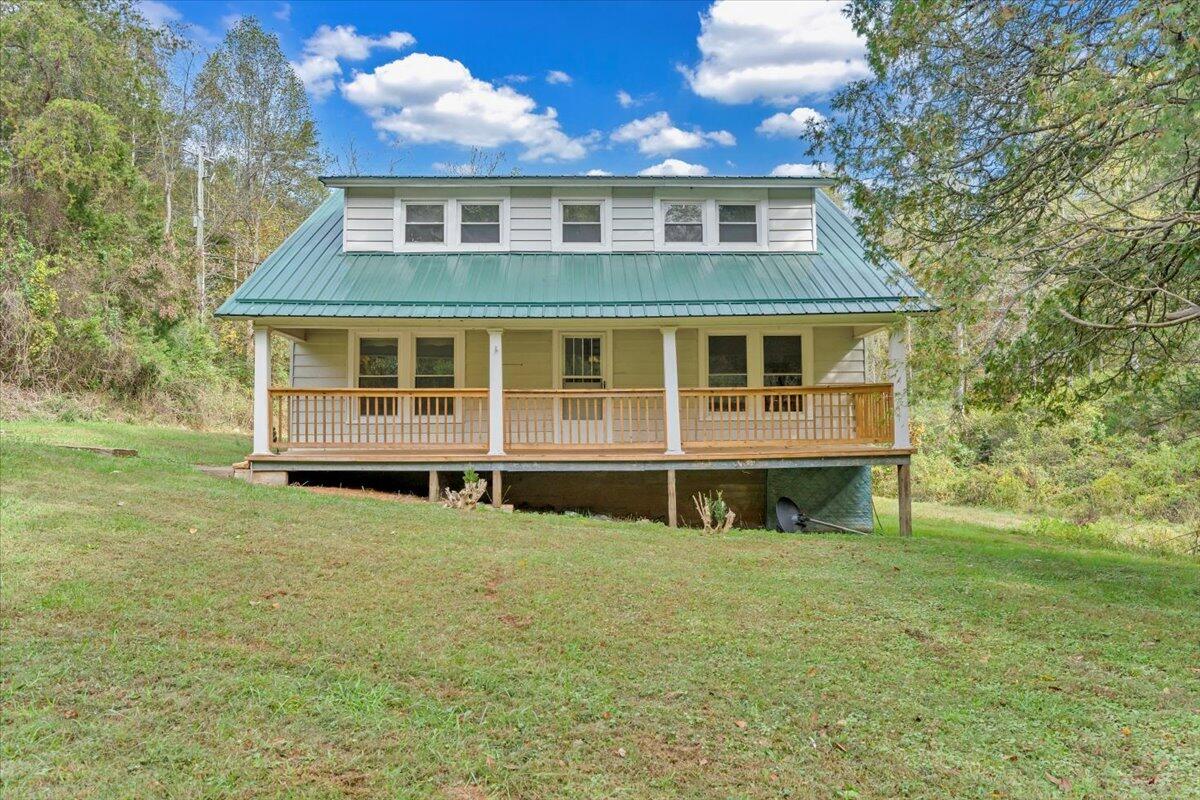 6973 Henry Road Henry, VA 24102 - Photo 64 of 110 a view of a house with yard and sitting area