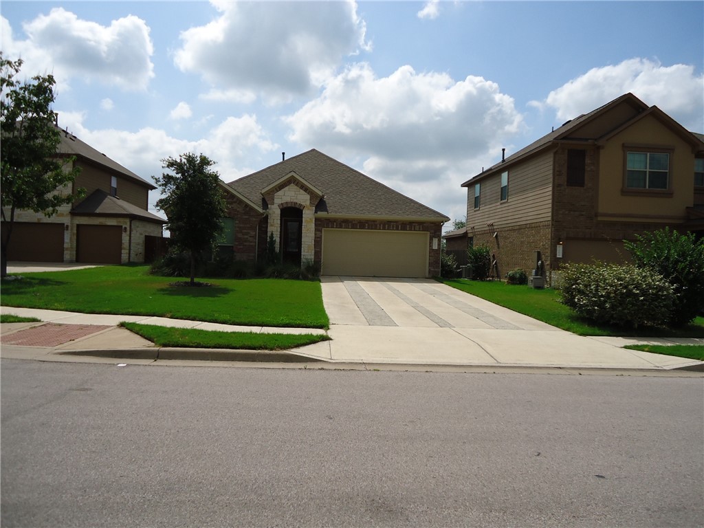 a view of house with yard