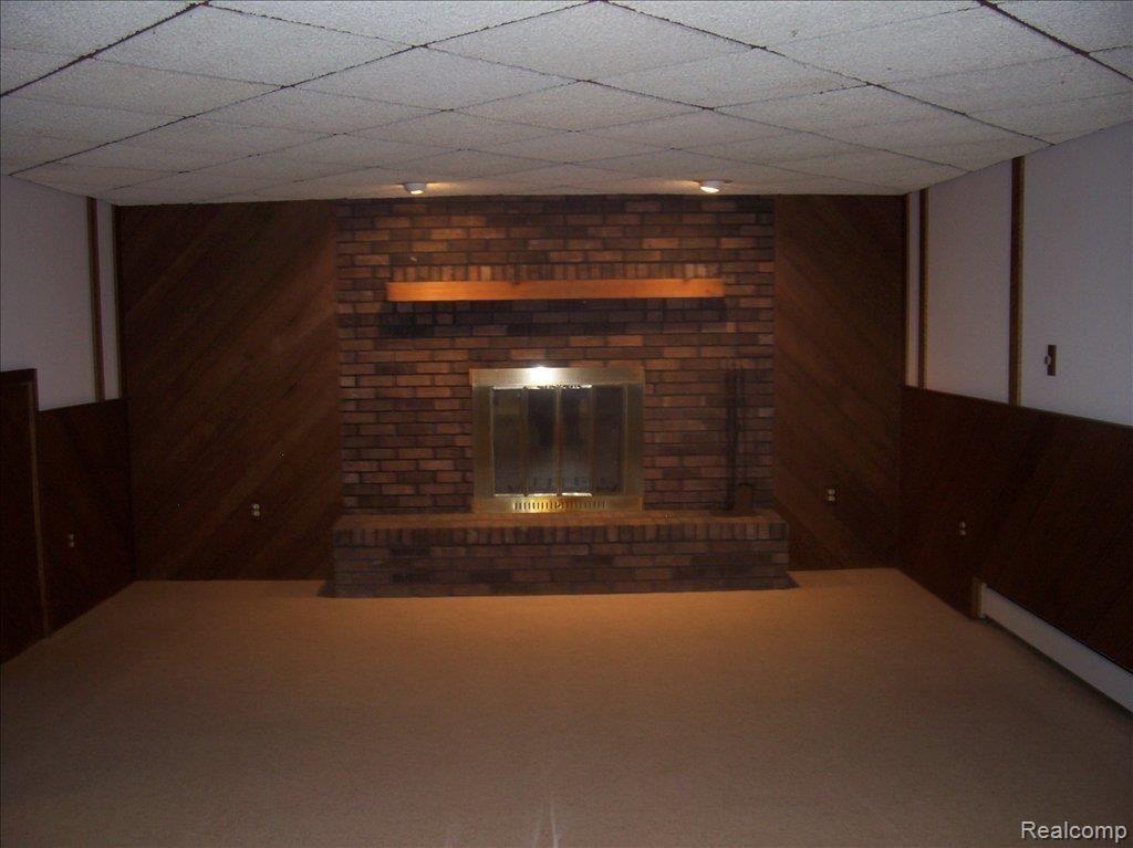 650 Murray Hill Road Highland, MI 48357 - Photo 11 of 13 Fireplace-Lower Level Great Room