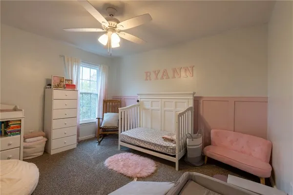 a bedroom with a bed and a couch