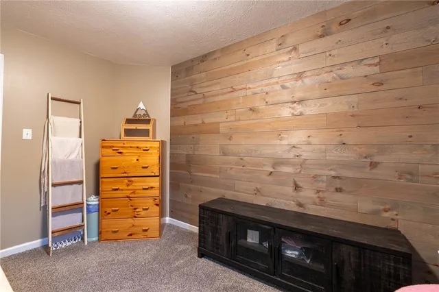 a view of an empty room and fire place