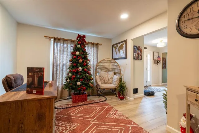 a living room with furniture and a potted plant