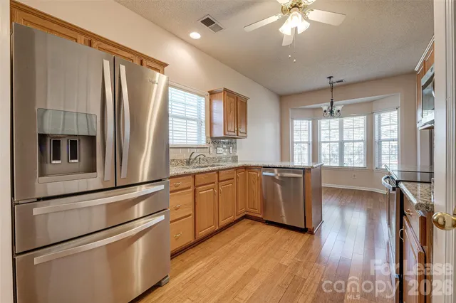 a kitchen with a refrigerator and a sink