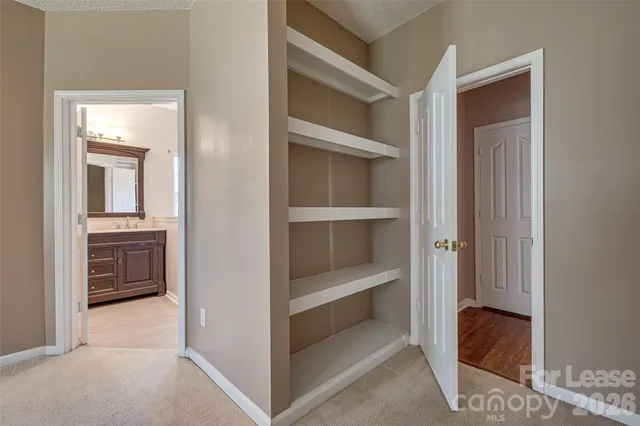 a en suite bathroom with a sink and a mirror