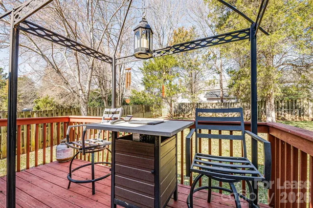 a view of a chairs and table in the balcony