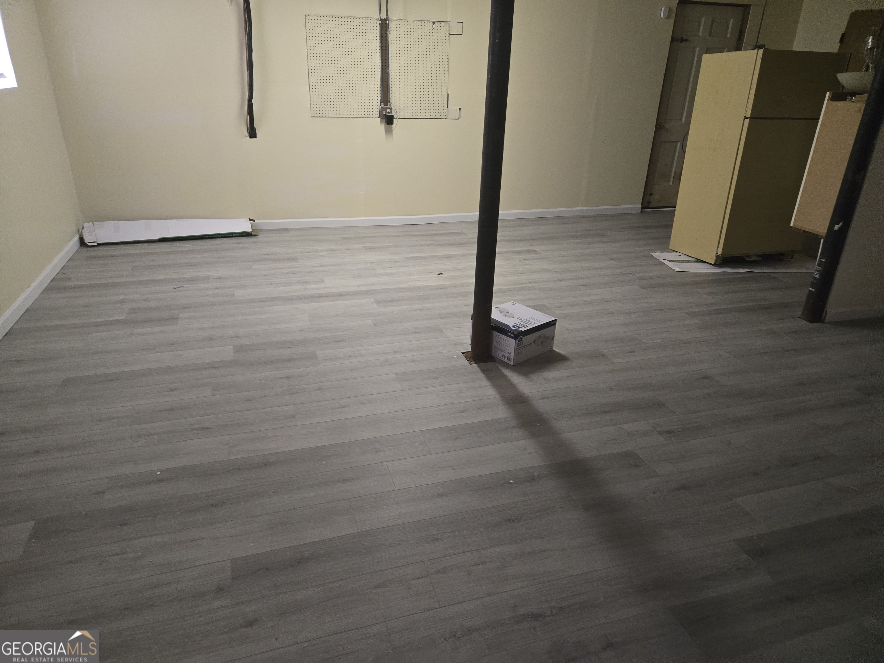 4749 Big Valley Road Stone Mountain, GA 30083 - Photo 3 of 7 a view of a room with wooden floor