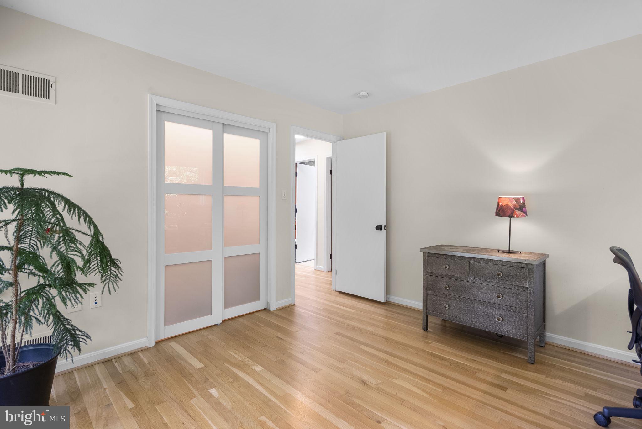 12806 Gaffney Road Silver Spring, MD 20904 - Photo 30 of 57 a view of a room with wooden floor and potted plant