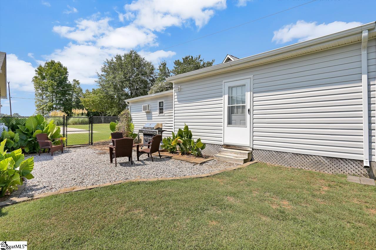 604 Foster Road Williamston, SC 29697 - Photo 22 of 24 Gravel Patio next to 2nd storage room and workshop