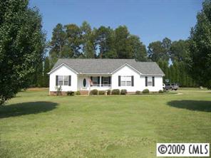 5946 Stokes Ferry Road Salisbury, NC 28146 - Photo 1 of 8 a view of house with garden and trees