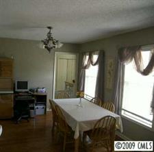 5946 Stokes Ferry Road Salisbury, NC 28146 - Photo 5 of 8 a view of a livingroom with furniture and window