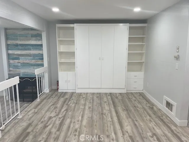 a view of an empty room with a fireplace