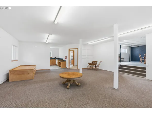 a living room with furniture and a chair