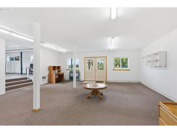 a living room with furniture and a table