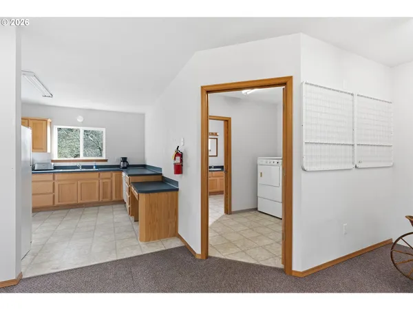 a kitchen with a refrigerator and a sink